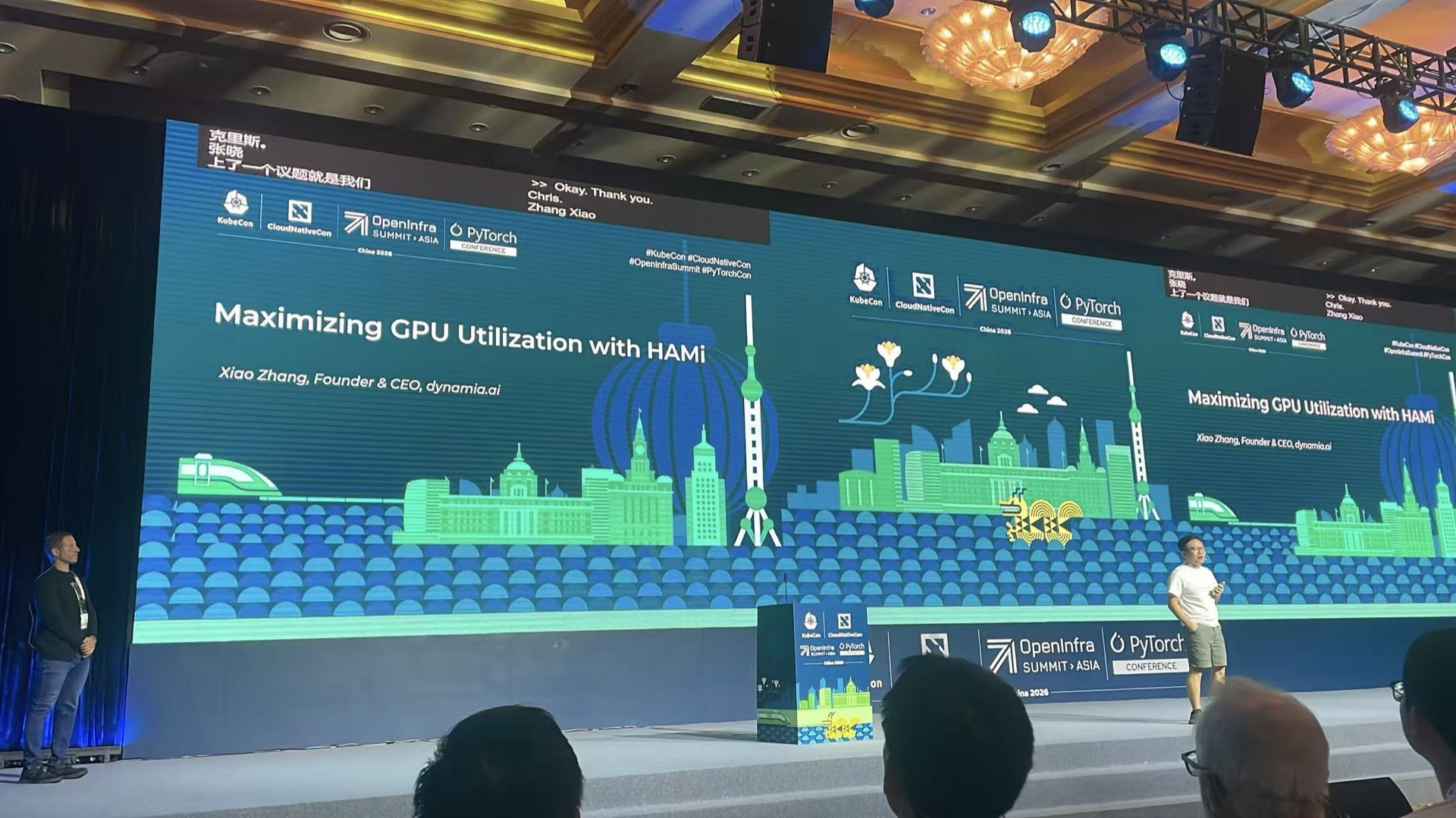 Xiao Zhang (Co-founder & CEO, Dynamia) on the opening keynote stage, co-presenting with Chris Aniszczyk (CTO, Cloud and Infrastructure, The Linux Foundation)